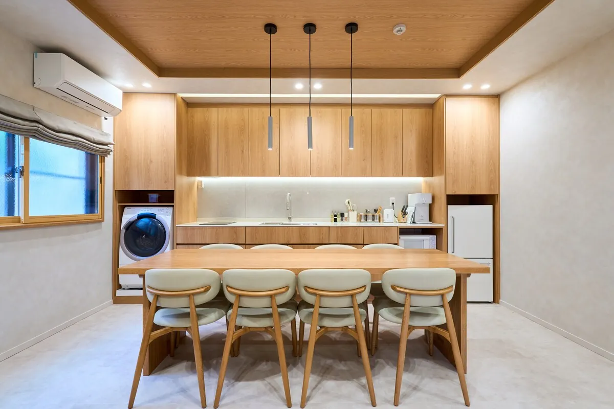 Warm wood dining room and kitchen in a STAY ARI Tokyo apartment